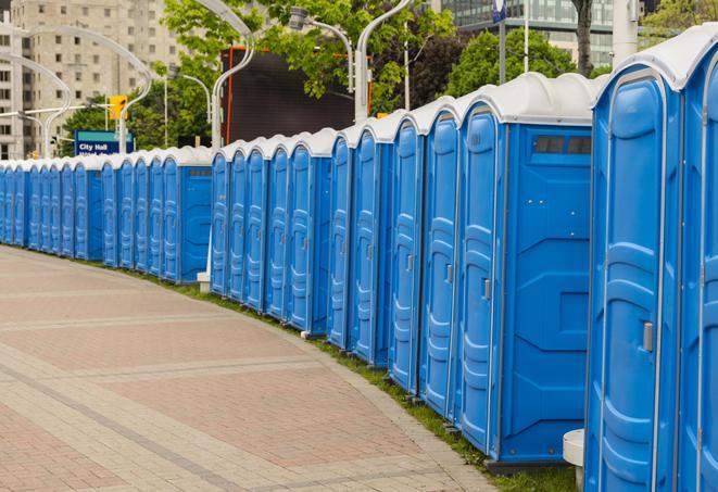 a row of portable restrooms at a fairground, offering visitors a clean and hassle-free experience in Billerica, MA